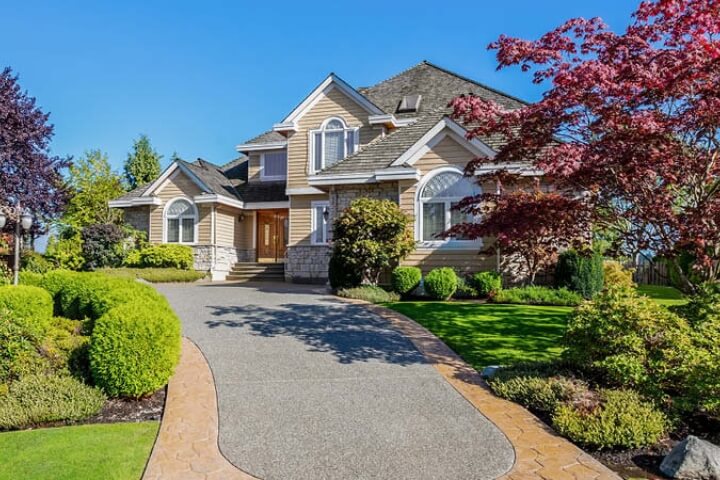 Upscale home with a beautiful garden and driveway