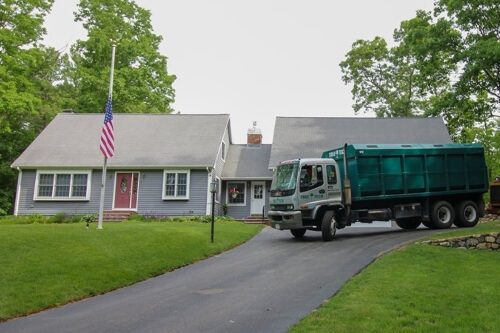 Tree Tech service truck parked in front of a residential home